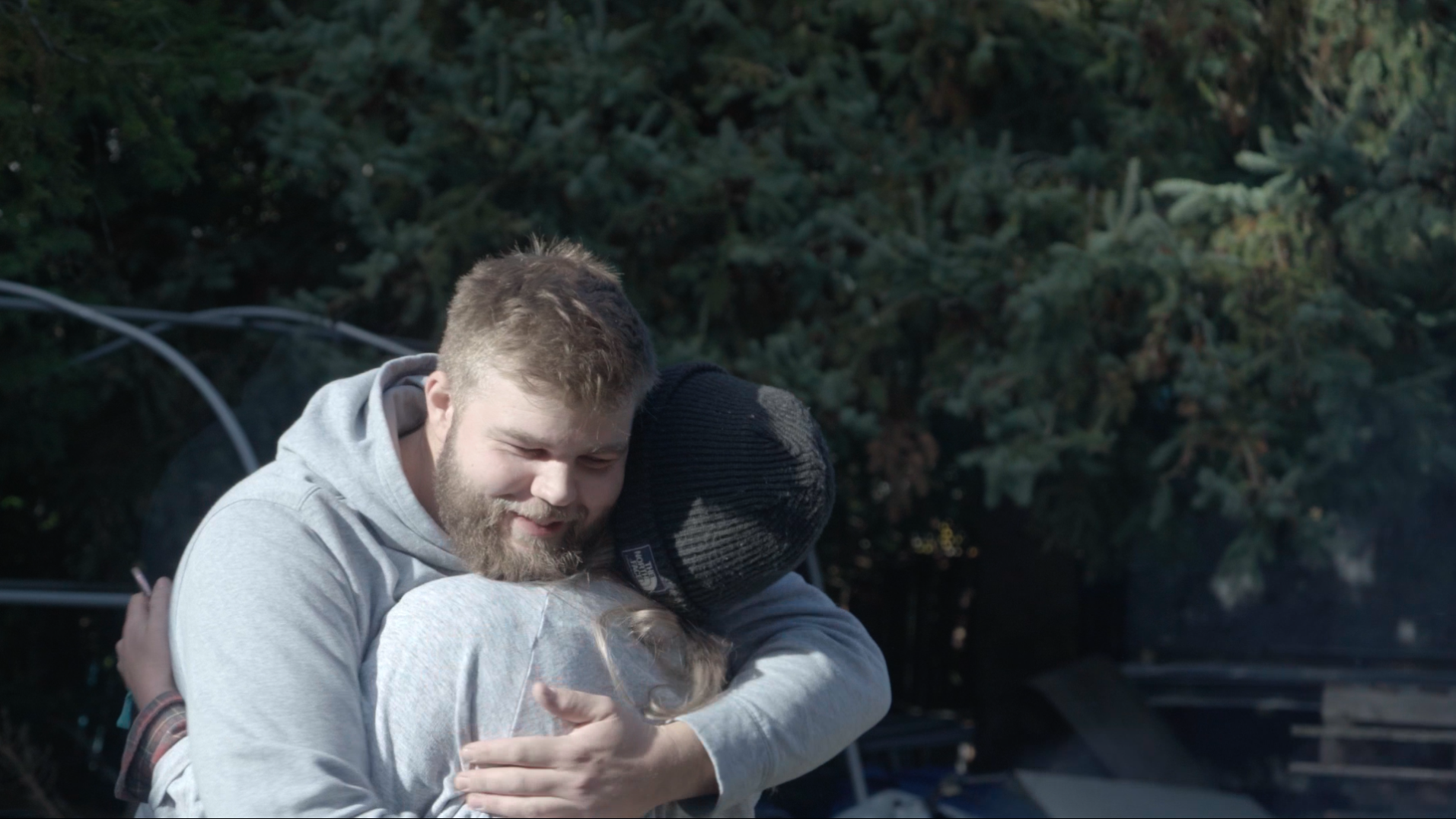 Brent hugging Rachel in an embrace