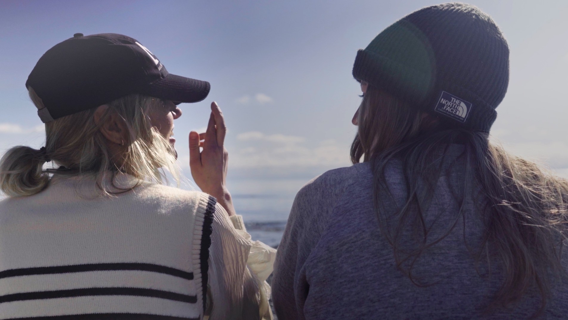Two women, Kayla and Rachel, talking outside